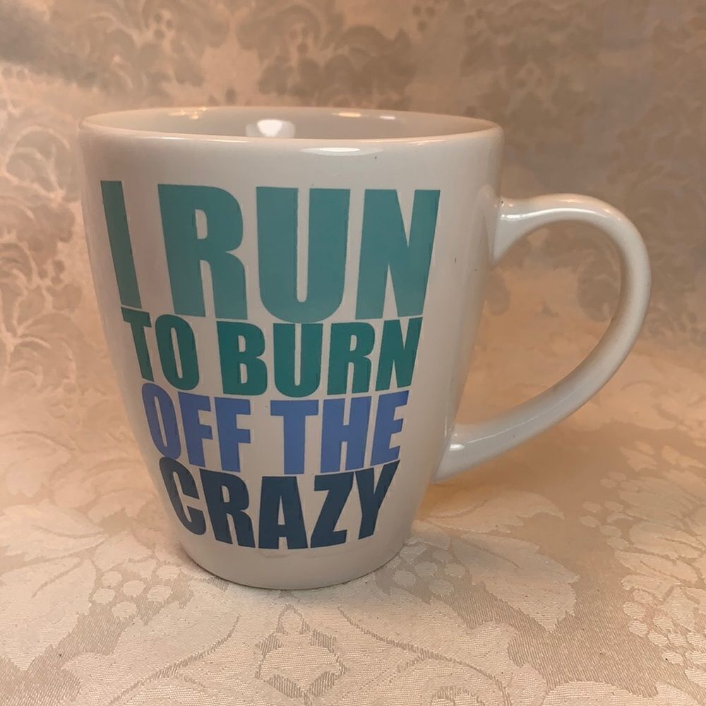 Secret Celebrity I Run To Burn Off The Crazy 16 Ounce Blue Lettering White Mug
